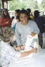 Child picking up scholrship check.jpg (137531 bytes)